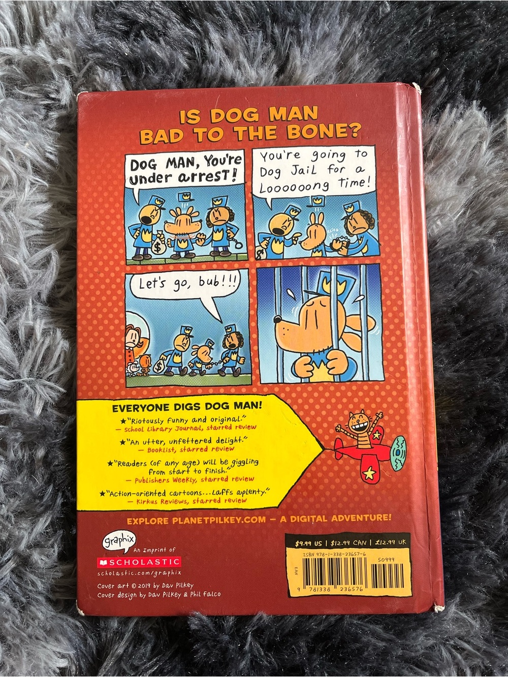 Scholastic Dog Man Paperback-Style Hardcover with Red and Yellow Comic Back